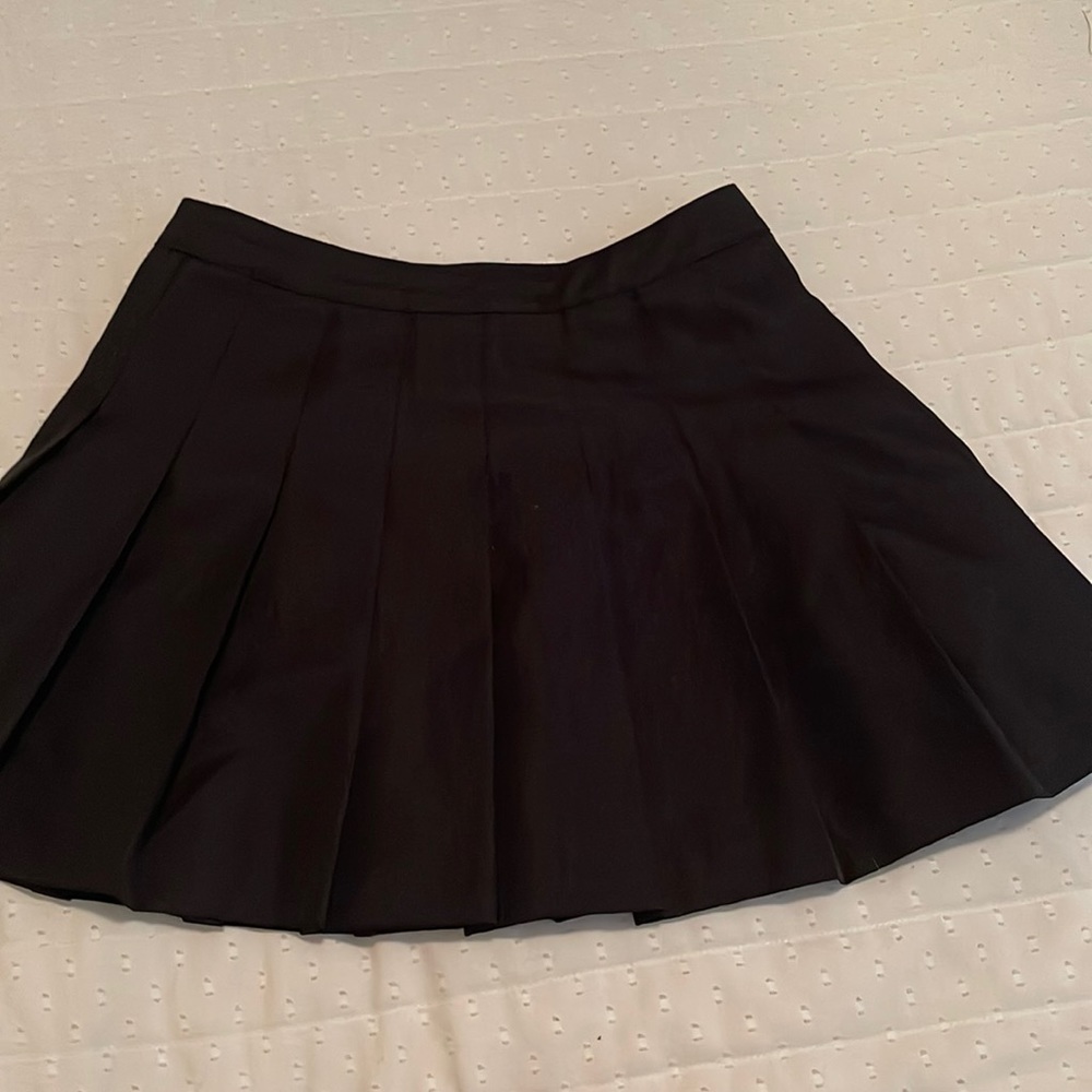 Black pleated mini skirt